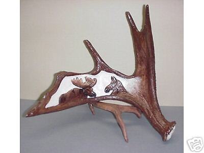 Carved Moose pair in Moose Antler Replica  